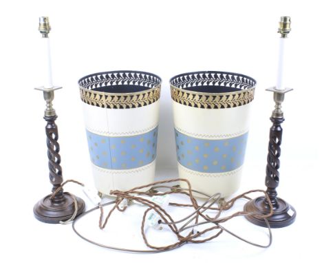 A pair of wooden twist carved and brass table lamp and a pair of metal waste bins. The lamps mounted on circular bases, H33cm
