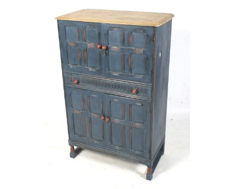 A later painted mid-century drinks cabinet. The two door top section opening to reveal mirrored back, glass shelf and a pull-