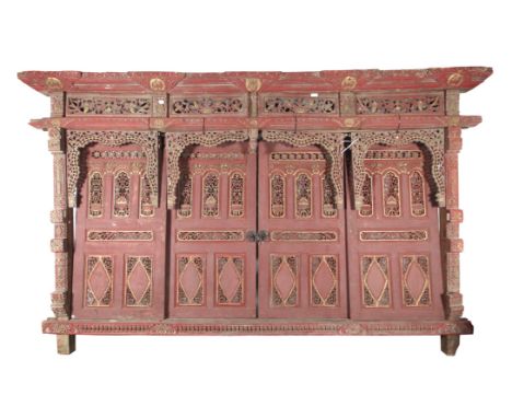 A set of vintage Thai wood room panels. Lacquered red and gold and richly carved with pierced bulrush motifs between solid ho