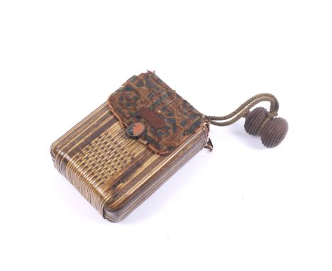 A circa 1900 Japanese tonkotsu form card case. The main body constructed of straw work, with a canvas flap decorated with emb