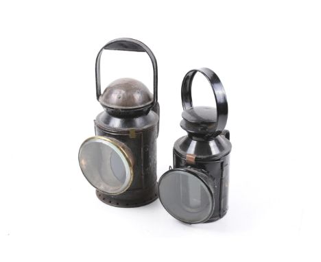 Two black painted vintage railway lamps. No marks, largest H34cm