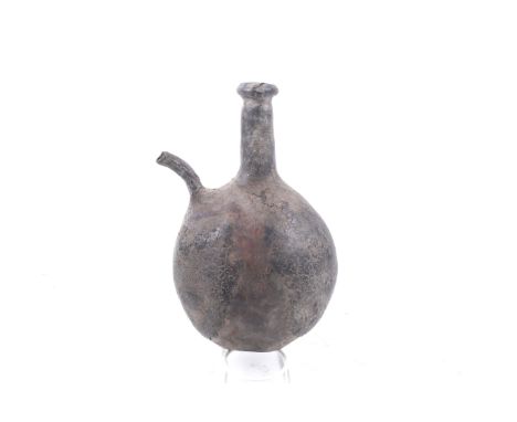 A probably 18th century pilgrim flask with a narrow spout. Possibly from the Ottoman Empire/North Africa, the 'camel bladder'