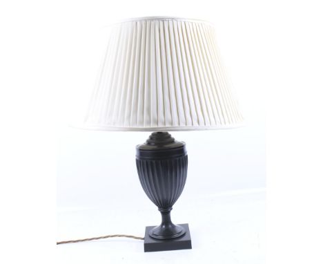 A contemporary bronzed classical urn shaped table lamp. On a square base, with cream shade. H35cm