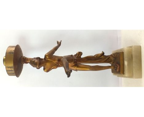 AN ART DECO TABLE LAMP in the form of a gilded spelter young woman on a stepped alabaster base, overall 30cm high 