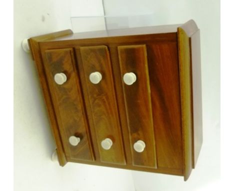 A VICTORIAN MAHOGANY MINIATURE CHEST OF THREE DRAWERS with hinged lid compartment, fitted white ceramic knob handles and feet
