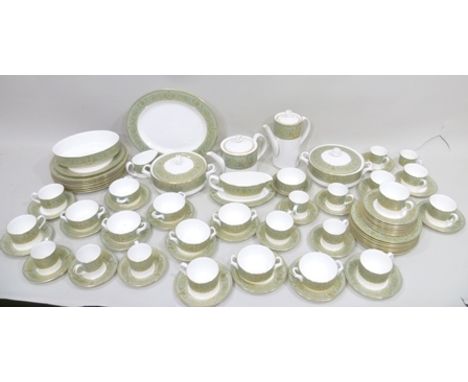 A ROYAL WORCESTER BONE CHINA DINNER SERVICE decorated with aqua green borders and profuse gilding, comprising 8 x 20cm plates