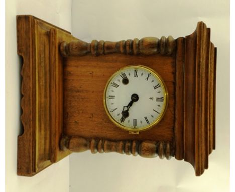 A MAHOGANY CASED MANTEL CLOCK, plain entablature, on turned half columns flanking dial with Roman numerals, circa 1900, 33cm 