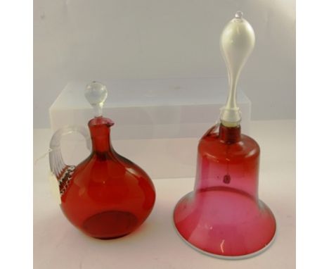 A VICTORIAN CRANBERRY GLASS HAND BELL with white handle and rim to the mouth, 30cm high (incl handle), mouth 15.5cm diameter 