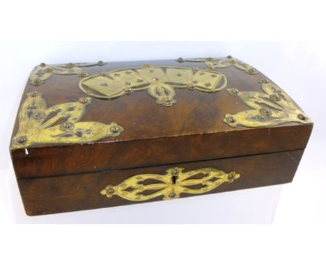 A VICTORIAN WALNUT VENEERED AND BRASS MOUNTED PLAYING CARDS BOX, the top fretted and studded with five cards and foliate form