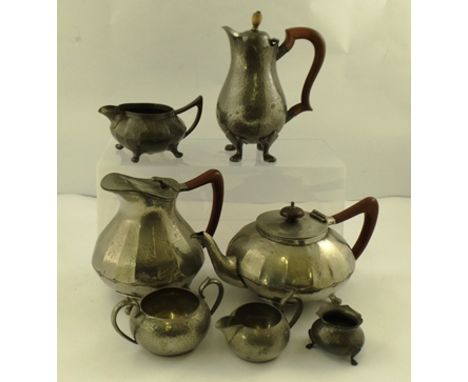 A "TUDRIC" HAMMERED PEWTER HOT WATER JUG (for Liberty & Co.) having hinged lid, on four substantial feet, 20cm, together with