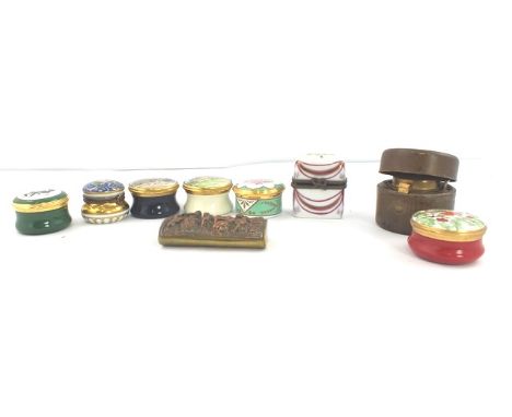 A COLLECTION OF FIVE ENAMEL PILL BOXES a Limoges pill box, a Limoges porcelain box containing two glass SCENT PHIALS, a brass