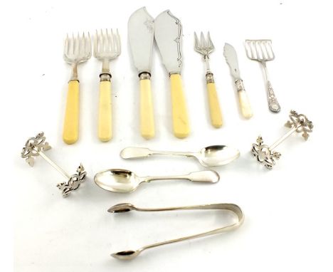 A QUANTITY OF SILVER PLATE to include; a pair of knife rests, a bread fork, two pairs of fish servers, tongs, a mother-of-pea