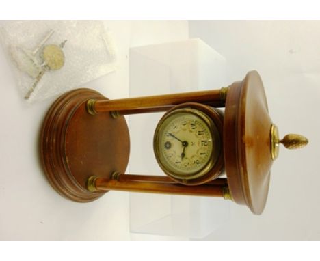 A GERMAN PORTICO CLOCK having brass mounted columns, the top with pineapple finial, floral decorated dial with Arabic numeral
