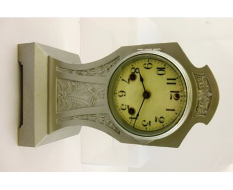 AN EARLY 20TH CENTURY CAST METAL CASED MANTEL CLOCK having Art Nouveau decorative panels, the dial with Roman numerals, 30cm 