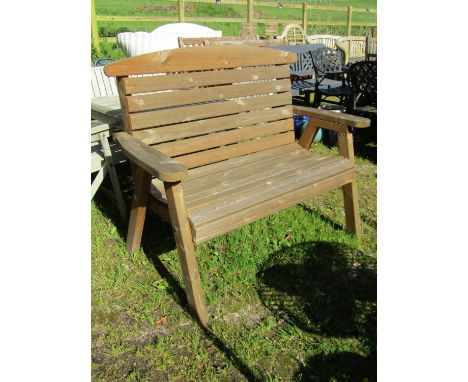A contemporary weathered softwood 2 seat garden bench with slatted seat and back raised on splayed supports, 127cm wide 