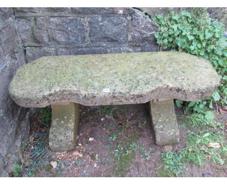 A good weathered cast composition stone crescent shaped bench, 113cm wide x 38cm deep x 46cm high 