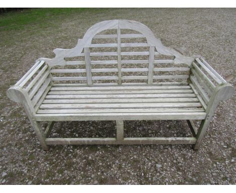 A weathered teakwood Lutyens style three seat garden bench, 167cm wide 