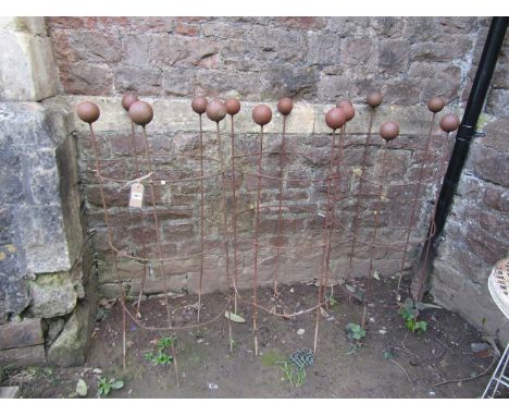 Three weathered light steel garden obelisks of cylindrical open ring form with ball finials, 120 cm (full height) x 55 cm (di