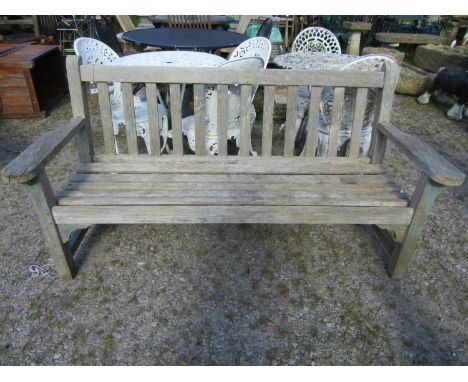 A weathered teak garden bench with slatted seat and back, with traces of painted finish, 162cm long (af) 