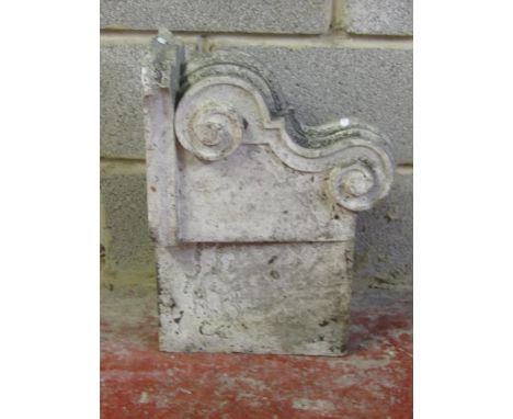 A carved natural stone corbel with scroll detail 40 cm high x 53 cm x 24 cm 