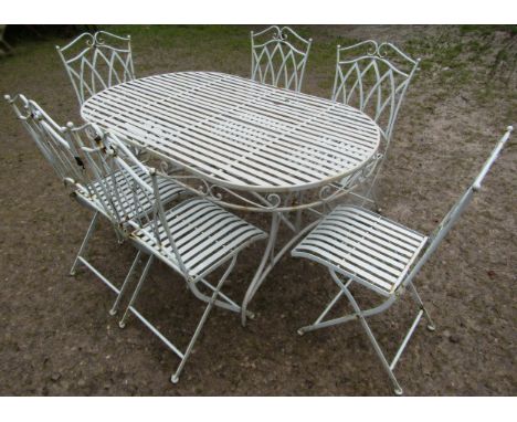 A light blue grey seven piece garden terrace set comprising table of oval form with strap work top 140 cm x 90 cm and a set o