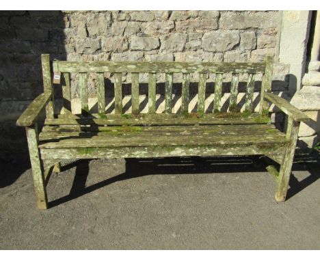 A vintage R A Lister weathered teak three seat garden bench with slatted seat and back, 159 cm wide 