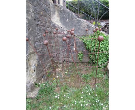 Four weathered light steel garden obelisks of cylindrical open ring form with ball finials, 120 cm (full height) x 55 cm (dia