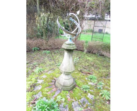 An Armillary sundial raised on an octagonal vase shaped pillar and stepped base, 140 cm (full height) 