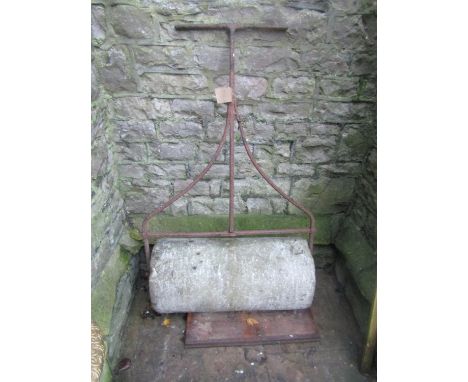 A 19th century (or possibly earlier) large stone garden roller, with wrought iron frame and T shaped handle, approx 90cm wide