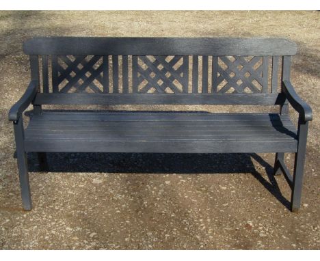 A Rayburn painted teak three seat garden bench with slatted seat and lattice panelled back (af) 160  cm wide 