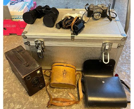 Aluminum case containing large box camera, Bencini Comet S Compact Camera, early box type cine camera, modern compact camera 