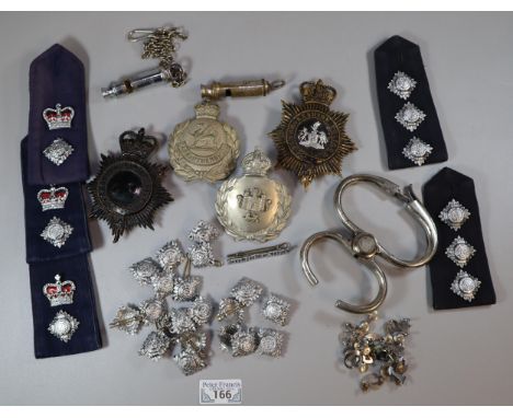 Collection of Police items to include: two Police whistles, the Metropolitan and an ARP Warden's whistle, Police helmet plate