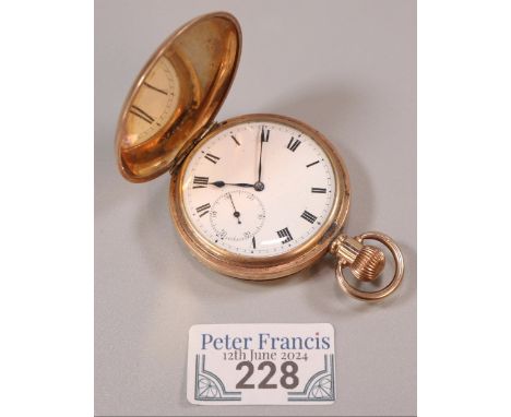 Yellow metal full hunter top wind pocket watch with white enamel Roman face having seconds dial. Engraved initials to the fro