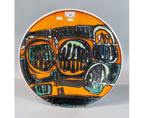 Poole Pottery Delphis charger on an orange ground with abstract designs. 42cm diameter approx. (B.P. 21% + VAT)&nbsp; &nbsp;N