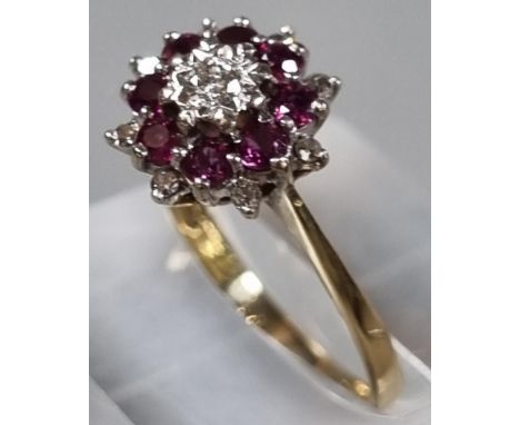 9ct gold gold diamond and rubies flowerhead ring. 2.6g approx. Size P1/2. (B.P. 21% + VAT)