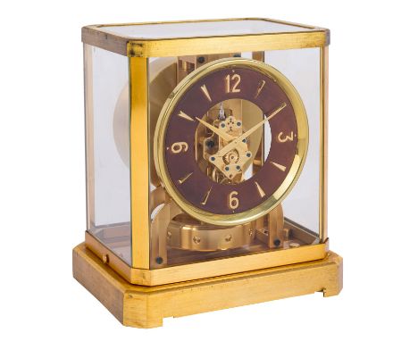 JAEGER-LECOULTRE "Atmos-Uhr" 1950er Jahre, Kaliber 519, Messing vergoldet, brauner Zifferblattring mit goldenen Ziffern 3, 6,