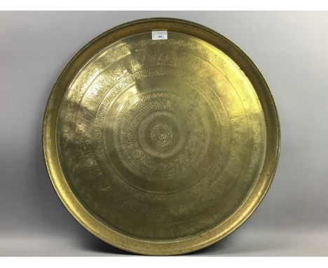 EASTERN BRASS CIRCULAR TRAY,60cm diameter, along with other brass ware including candlesticks, scales and a picture frame