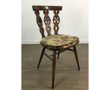 SET OF FOUR ERCOL DINING CHAIRS,along with a pair of Ercol spindle back carver chairs and an oak extending dining table (7)