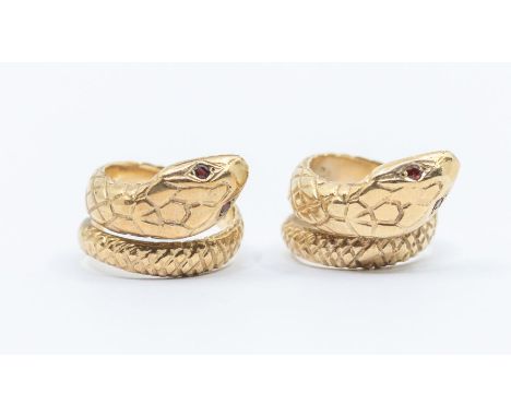 Two 9ct gold rings in the form of serpents, both similar, ruby set eyes and embossed scale decoration, width approx 20mm, siz