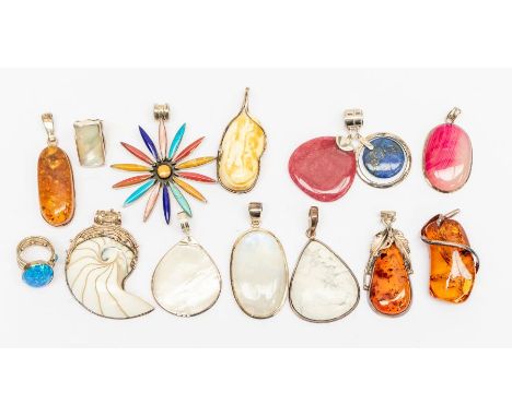 A collection of silver stone set jewellery to include pendants including an egg yolk amber pendant, three clarified amber pen