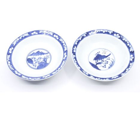 Two 20th Century Chinese blue and white bowls, each one 18cm diameter, with wax seal remains to base stems, one bowl having n