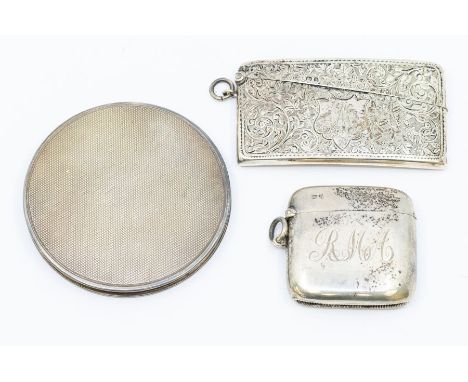 A collection of early 20th Century silver to include: a profusely engraved card case, with monogram and dated 14th February 1