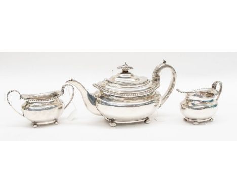 A George IV silver teapot, gadroon border, C-scroll handle with acanthus thumbpiece and leaf decoration to spout, oval pagoda