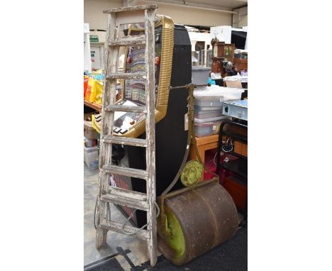 An early 20th Century vintage cast iron lawn barrel roller and a set of vintage wooden steps / ladder (2)&nbsp;&nbsp;