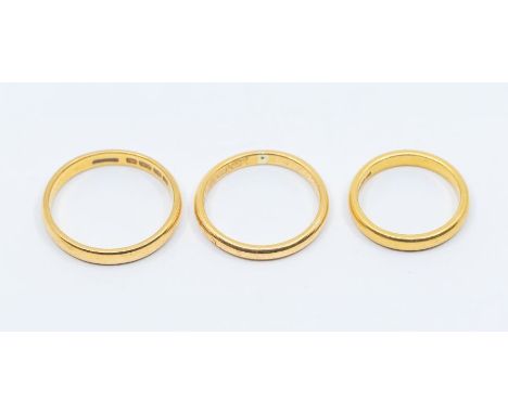 Three 22ct wedding bands, sizes R, O, J, combined weight approx 11.2gms&nbsp;