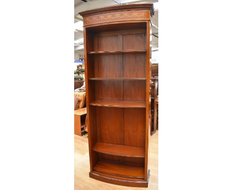 A tall reproduction mahogany five-shelf bookcase with Adam-style inlaid top
