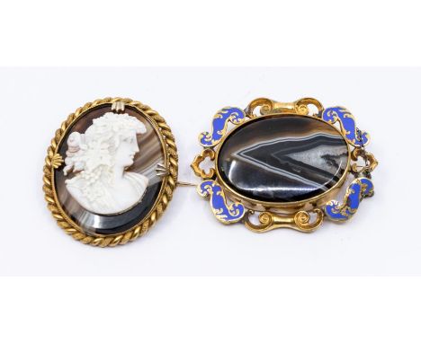 A Victorian shell and agate brooch, the oval banded agate mounted with a shell cameo depicting a Bacchante, in an unmarked ye