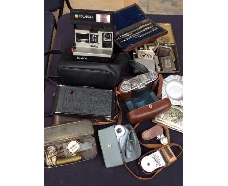 A collectors lot to include; vintage cameras including Vito and Polaroid, Trent art lighters, vesta cases, platform whistles,