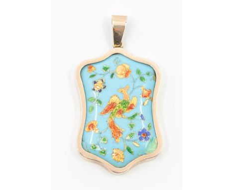 An enamel and yellow metal pendant cartouche shaped with turquoise enamel inset with bird and foliate decoration of various c