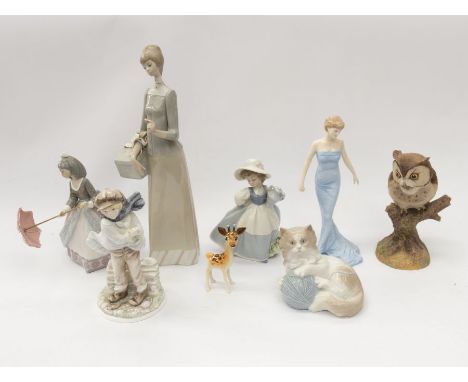 A collection of china figures to include: 1. Lladro - Lady with ribbon tied box, factory stamp2. LLadro - Girl with parasol, 